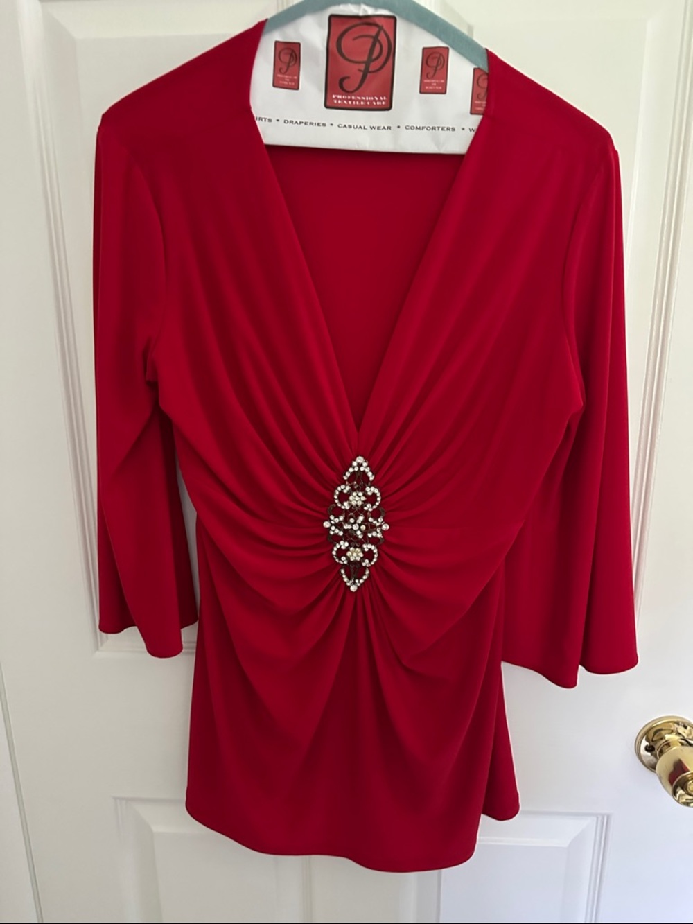 Red V-Neck Gathered Blouse with Decorative Brooch